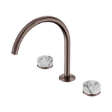 An image of Nero Tapware's Serenity Bath/Kitchen Set Arc Spout With Arabescato Corchia Handle Brushed Bronze