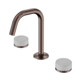 An image of Nero Tapware's Serenity Basin Set Edge Spout With Carrara Handle Brushed Bronze