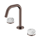 An image of Nero Tapware's Serenity Basin Set Edge Spout With Arabescato Corchia Handle Brushed Bronze
