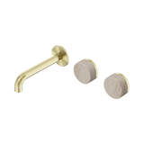 An image of Nero Tapware's Serenity Wall Basin Set 160mm Offset Spout With Rome Travertine Handle Brushed Gold