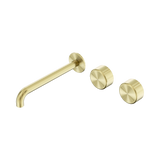 An image of Nero Tapware's Serenity Wall Basin Set 220mm Offset Spout With Metal Handle Brushed Gold