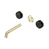 An image of Nero Tapware's Serenity Wall Basin Set 160mm Spout With Marquina Black Handle Trim Kit Only Brushed Gold