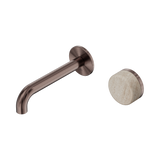 An image of Nero Tapware's Serenity Progressive Wall Basin Mixer 160mm Spout With Rome Travertine Handle Brushed Bronze