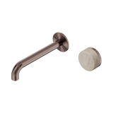 An image of Nero Tapware's Serenity Progressive Wall Basin Mixer 185mm Spout With Rome Travertine Handle Brushed Bronze
