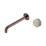 An image of Nero Tapware's Serenity Progressive Wall Basin Mixer 220mm Spout With Rome Travertine Handle Brushed Bronze