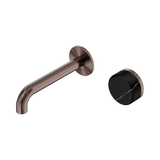 An image of Nero Tapware's Serenity Progressive Wall Basin Mixer 160mm Spout With Marquina Black Handle Brushed Bronze