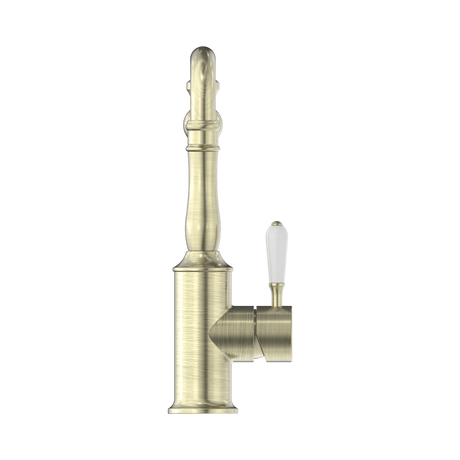 An image of Nero Tapware York Kitchen Mixer Hook Spout With White Porcelain Lever Aged Brass