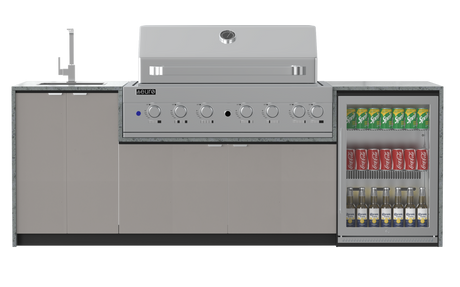 An outdoor kitchen with beige coloured cabinets and stainless steel appliances